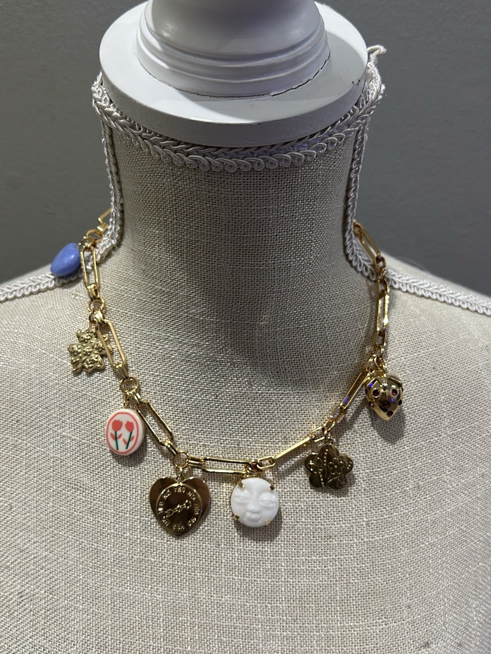 Gold-Tone Charm Necklace with White Cameo and Floral Charms from Target